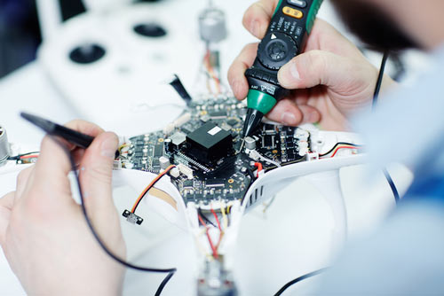 Student working on a drone.